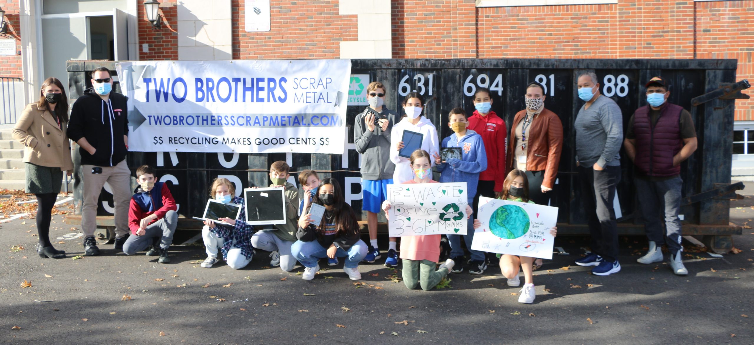 Students from Mineola Middle School pose with some of the electronic devices they collected during their fifth annual eWaste Drive on October 28.